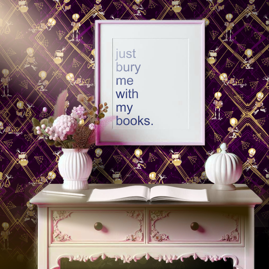 Dark purple, gold, and white wallpaper featuring cartoon skeletons reading books compliments a feminine style desk.  A framed print says "Just bury me with my books."