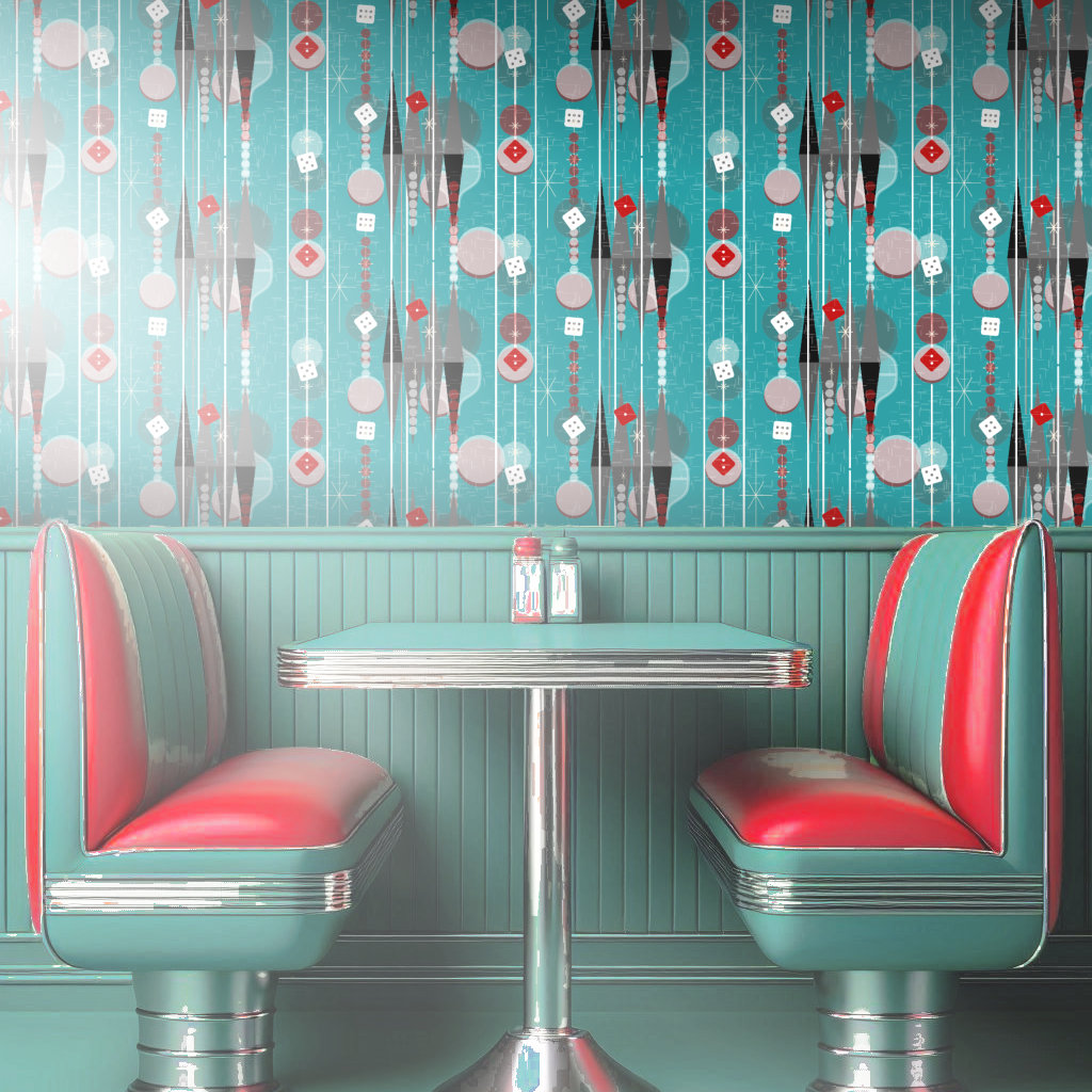 Wallpaper in aqua, red, and white tones featuring symbols from backgammon compliments an aqua and red 1950s style diner booth.